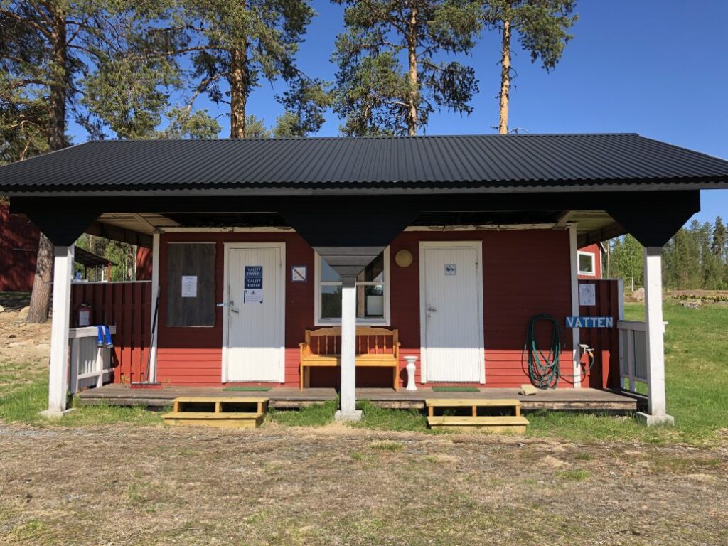 Doors to a toilet and a washroom.